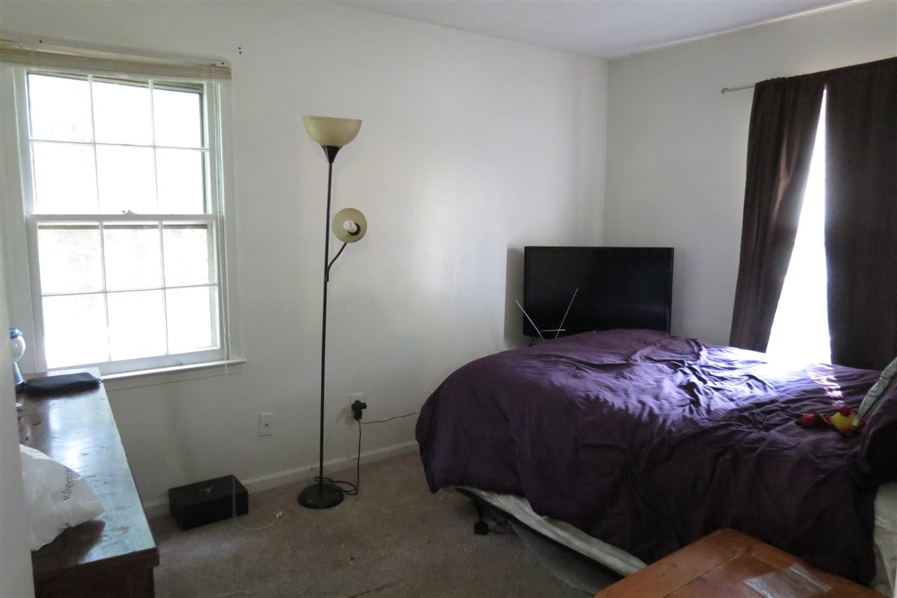 5114 McCormick Road Durham, NC 27713 - Photo 10 of 25 a bedroom with a bed and a window