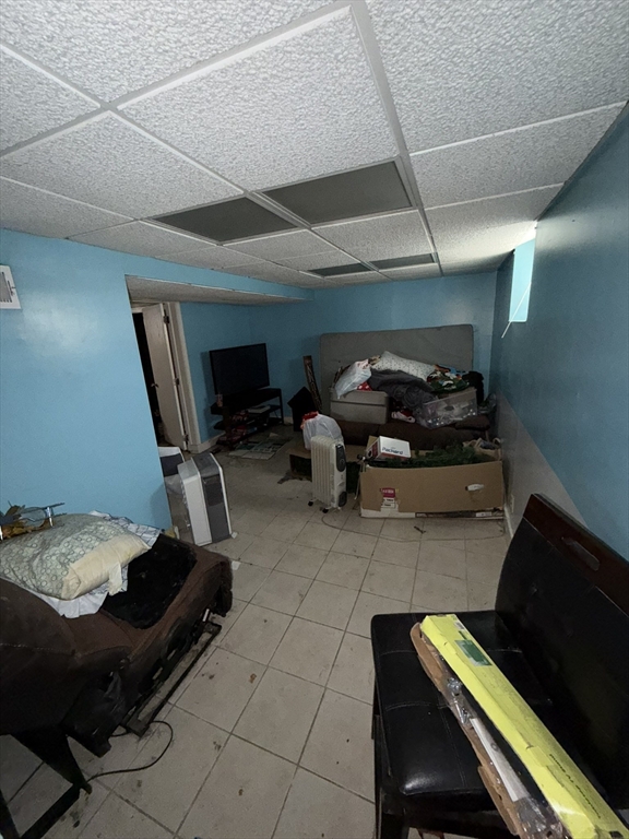 496 Tucker Street Fall River, MA 02721 - Photo 11 of 19 a room with furniture and a flat screen tv