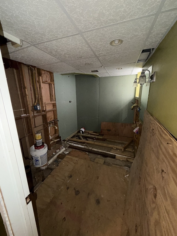 496 Tucker Street Fall River, MA 02721 - Photo 13 of 19 a room with water heater and a wooden door