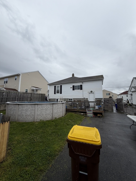 496 Tucker Street Fall River, MA 02721 - Photo 18 of 19 a view of a house with backyard patio and swimming pool