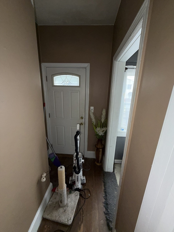496 Tucker Street Fall River, MA 02721 - Photo 5 of 19 a room with furniture and wooden floor