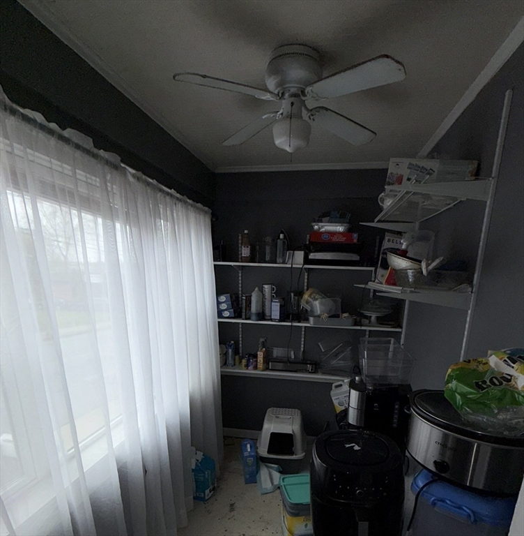 496 Tucker Street Fall River, MA 02721 - Photo 6 of 19 a room with lots of wooden cabinets
