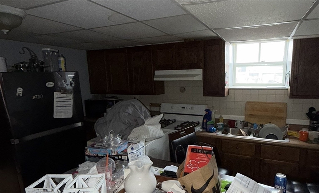496 Tucker Street Fall River, MA 02721 - Photo 9 of 19 a room with furniture closet and window