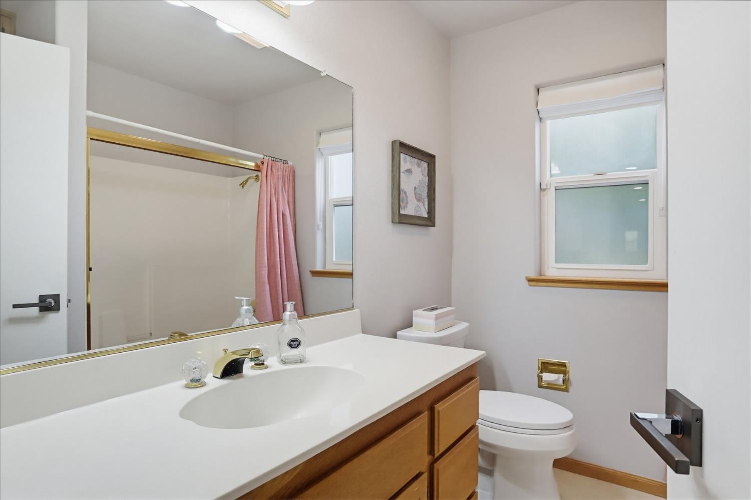 18639 Fay Ridge Court Grass Valley, CA 95949 - Photo 41 of 99 a bathroom with a sink toilet and mirror