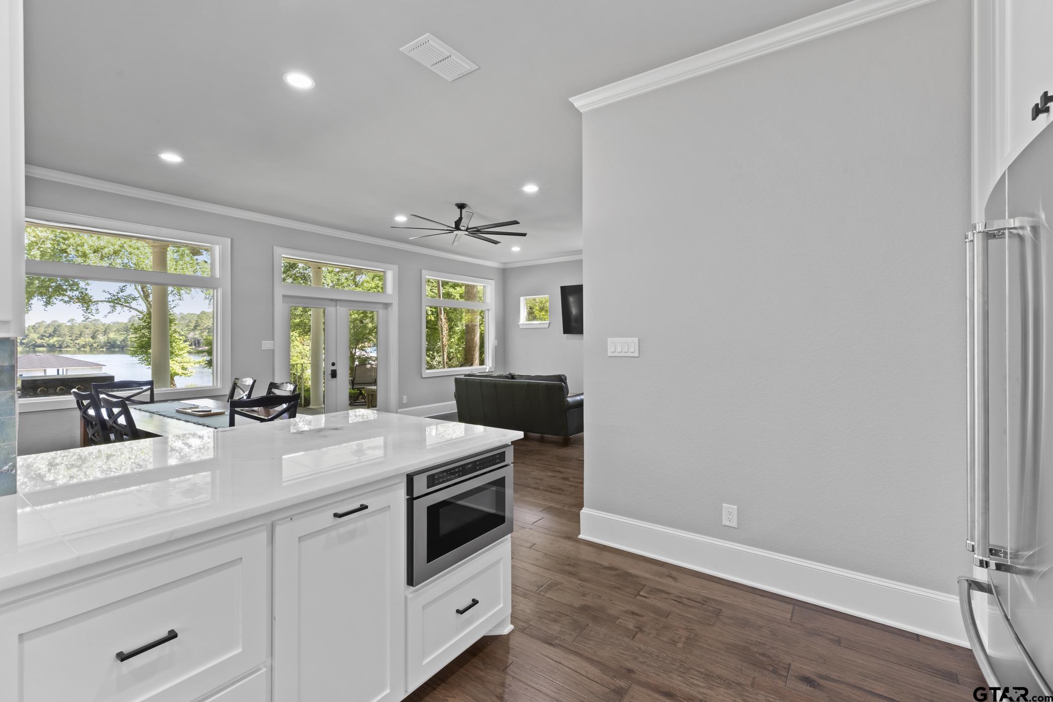 18630 Eastside Road Troup, TX 75789 - Photo 18 of 47 a view of a kitchen counter space a sink wooden floor and windows