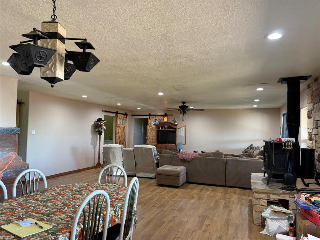 5355 Banks Road Fort Worth, TX 76140 - Photo 11 of 24 a living room with furniture and a flat screen tv