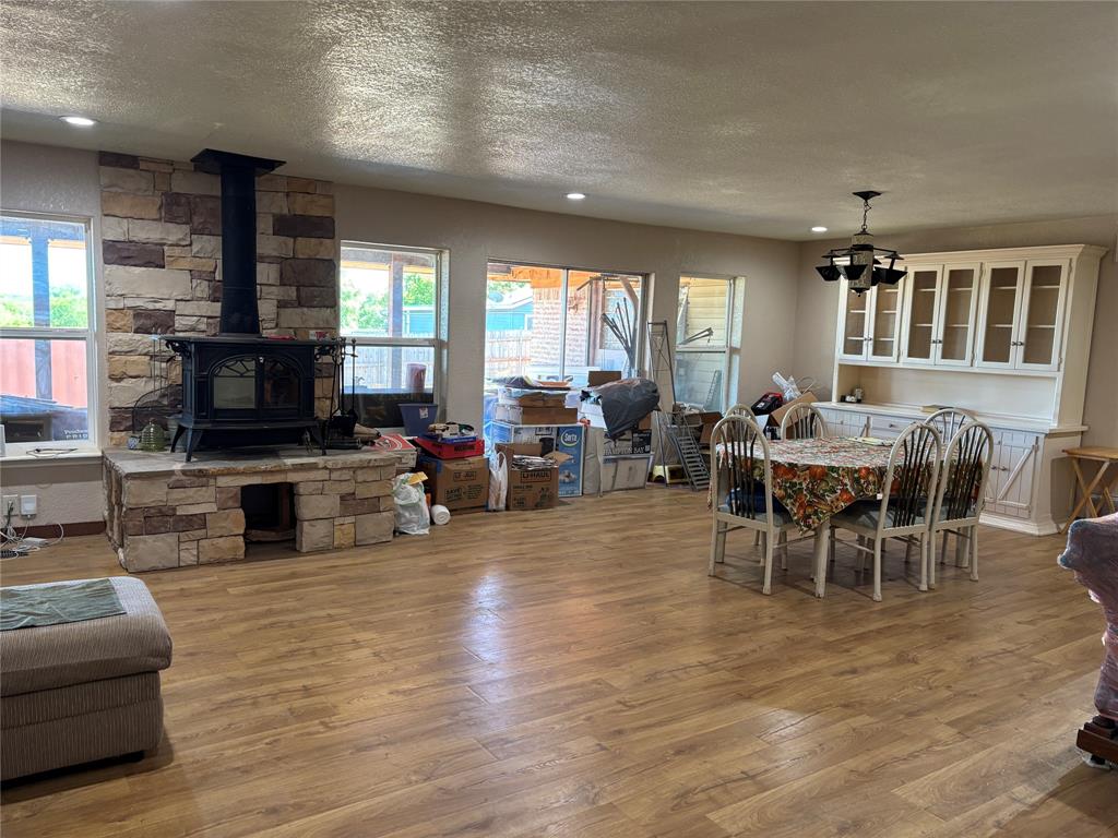 5355 Banks Road Fort Worth, TX 76140 - Photo 13 of 24 a living room with furniture flat screen tv and a fireplace