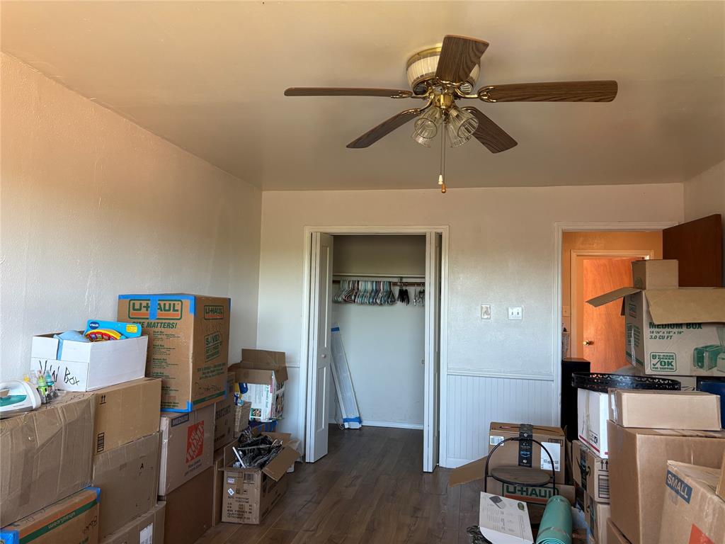 5355 Banks Road Fort Worth, TX 76140 - Photo 22 of 24 a room with furniture and a wooden floor