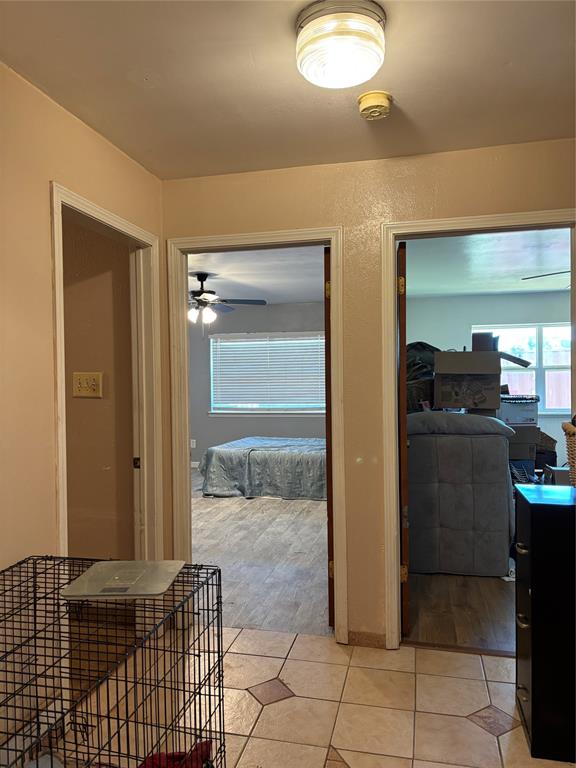 5355 Banks Road Fort Worth, TX 76140 - Photo 24 of 24 a bedroom with a bed and glass door