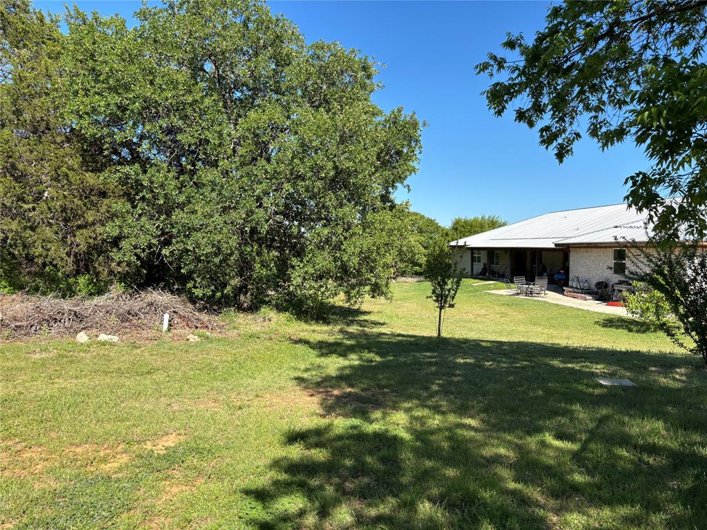 5355 Banks Road Fort Worth, TX 76140 - Photo 6 of 24 a backyard of a house with lots of green space
