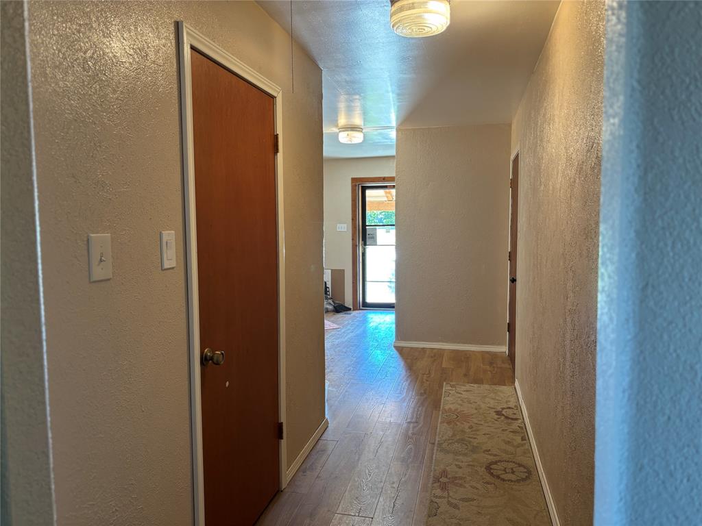 5355 Banks Road Fort Worth, TX 76140 - Photo 10 of 24 a view of a hallway with wooden floor