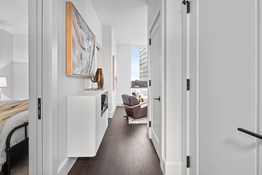 40 Trinity Place, Unit U25D Boston, MA 02116 - Photo 6 of 12 a view of a hallway with furniture and entryway to a livingroom