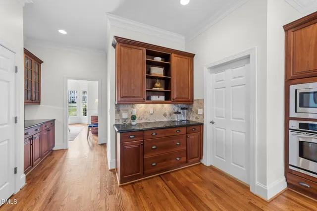 a bed room with a bed and a ceiling fan