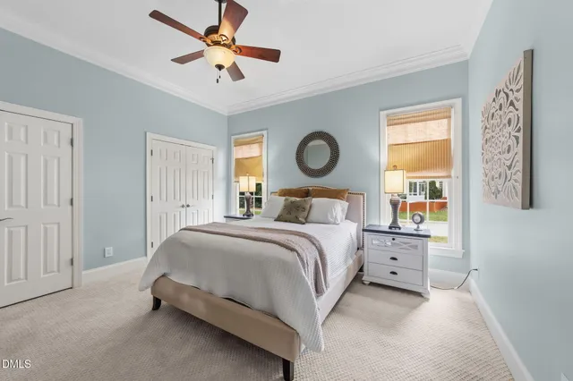 a bathroom with a tub a shower and a window