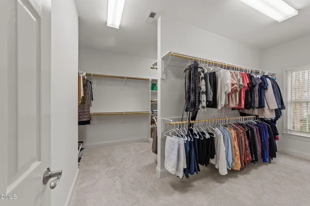 a bathroom with a sink toilet a mirror a vanity and shower