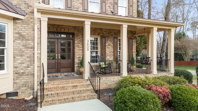 a view of a livingroom with wooden floor and stairs