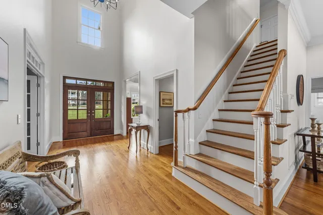 a living room with furniture a window and gym equipment