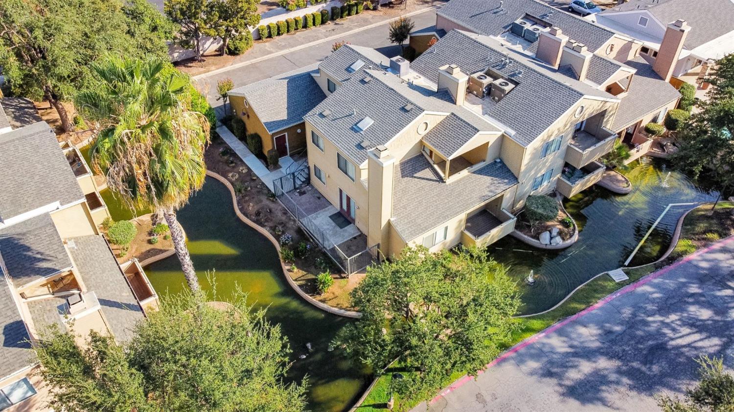 7675 North First Street, Unit 136 Fresno, CA 93720 - Photo 1 of 40 an aerial view of a house with garden space and street view