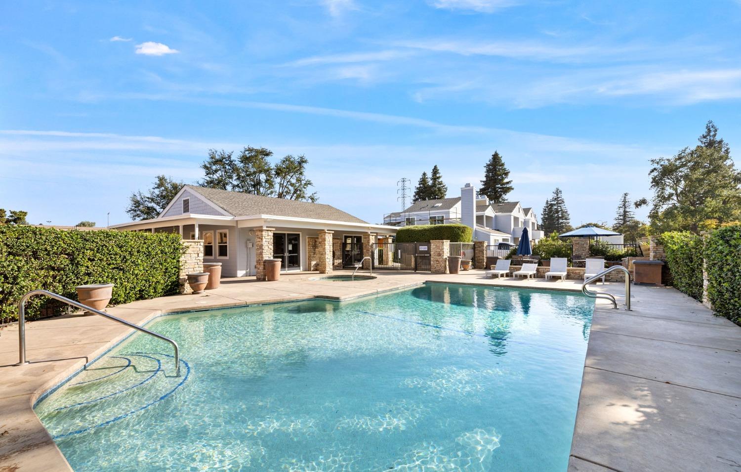 7675 North First Street, Unit 136 Fresno, CA 93720 - Photo 29 of 40 a view of a house with pool and chairs