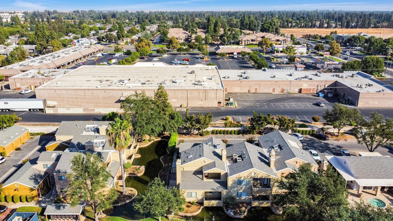 7675 North First Street, Unit 136 Fresno, CA 93720 - Photo 35 of 40 an aerial view of residential houses with outdoor space