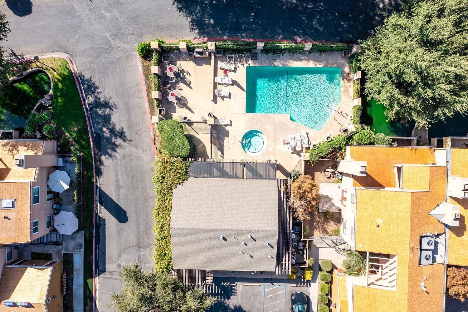 7675 North First Street, Unit 136 Fresno, CA 93720 - Photo 36 of 40 an aerial view of a house with a swimming pool