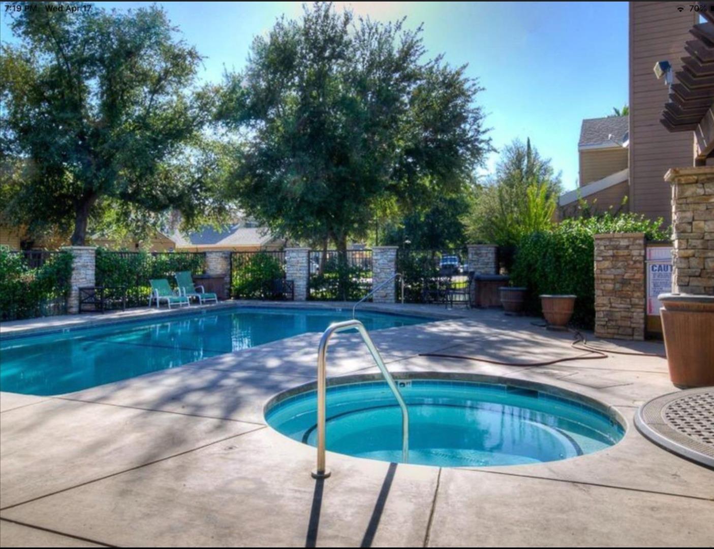 7675 North First Street, Unit 136 Fresno, CA 93720 - Photo 38 of 40 a front view of a house with garden