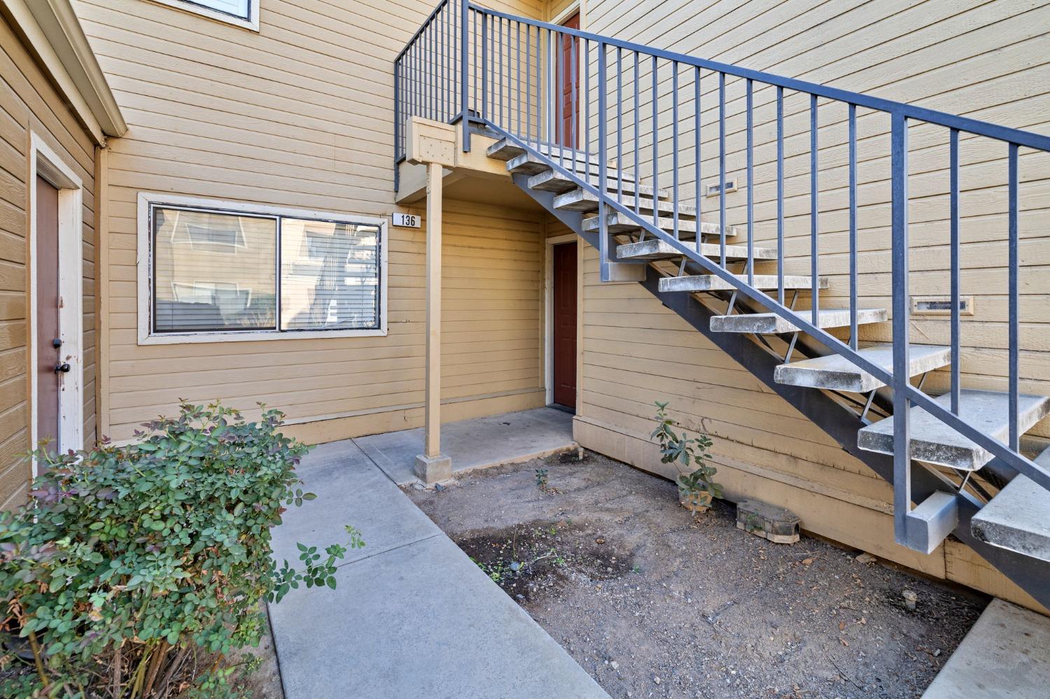 7675 North First Street, Unit 136 Fresno, CA 93720 - Photo 5 of 40 a view of entryway with wooden floor