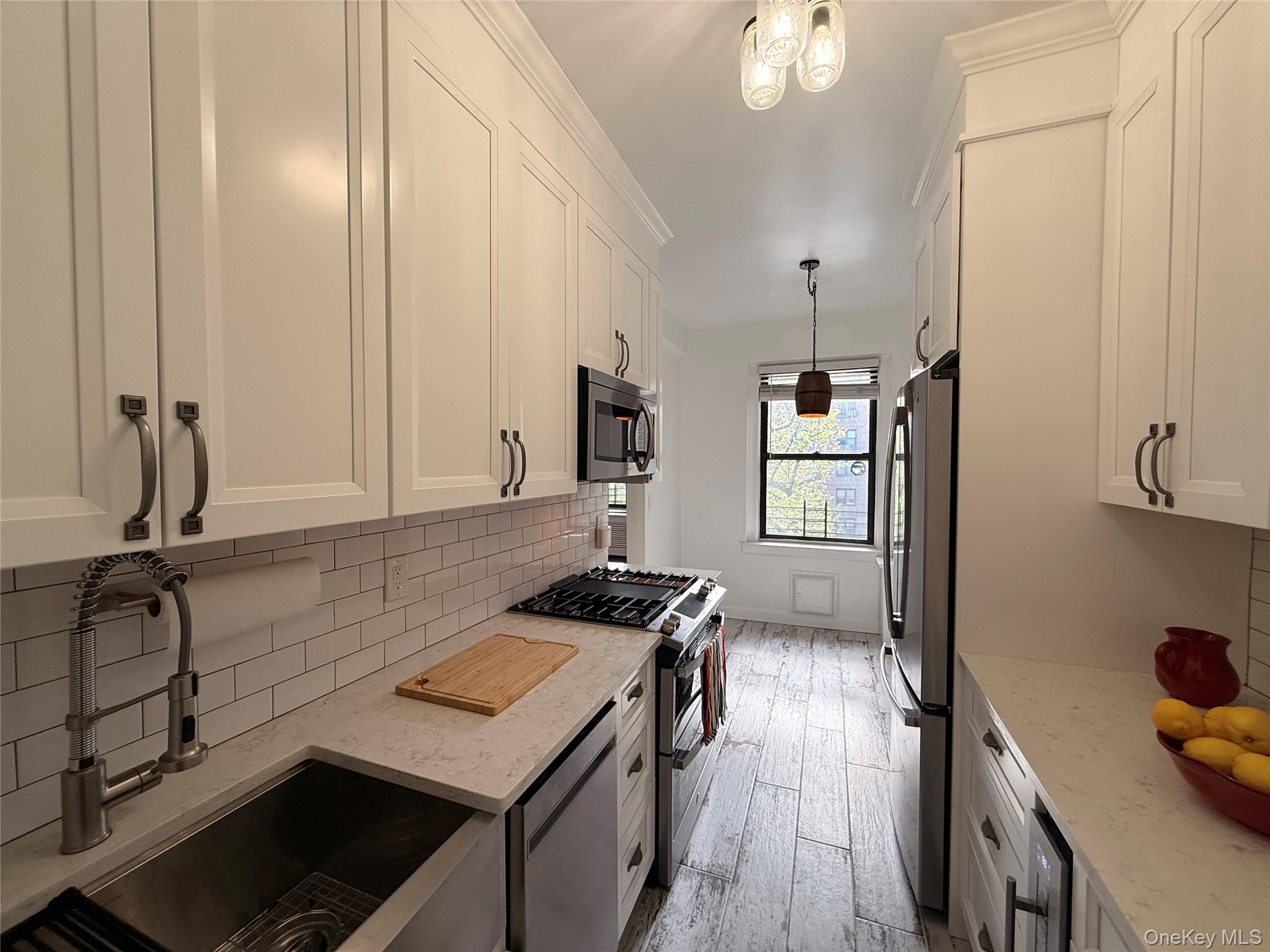 143 Garth Road, Unit 3L Scarsdale, NY 10583 - Photo 22 of 37 Newly renovated kitchen with new stainless steel appliances