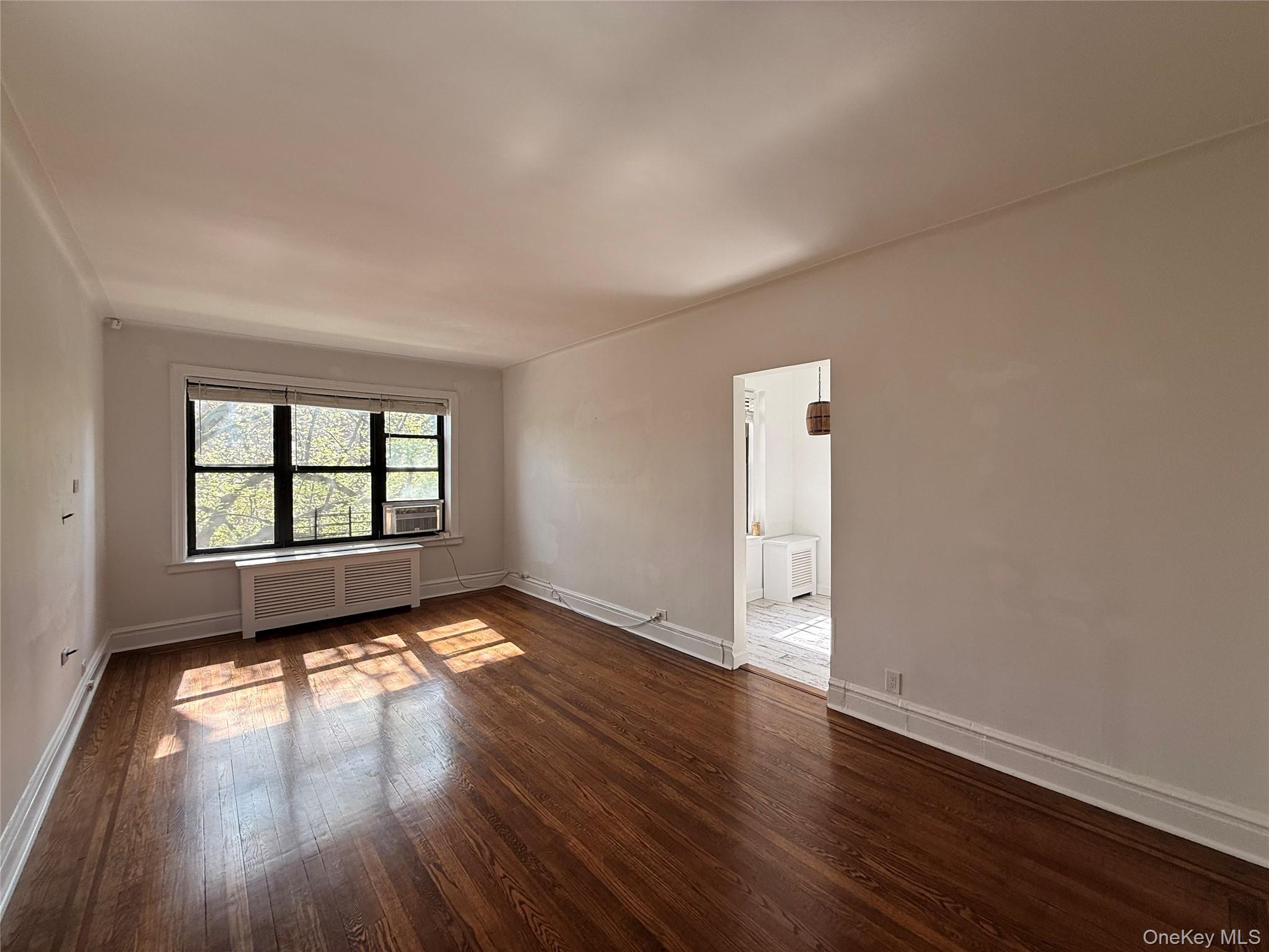 143 Garth Road, Unit 3L Scarsdale, NY 10583 - Photo 8 of 37 Living Room with entrance to the kitchen dining area