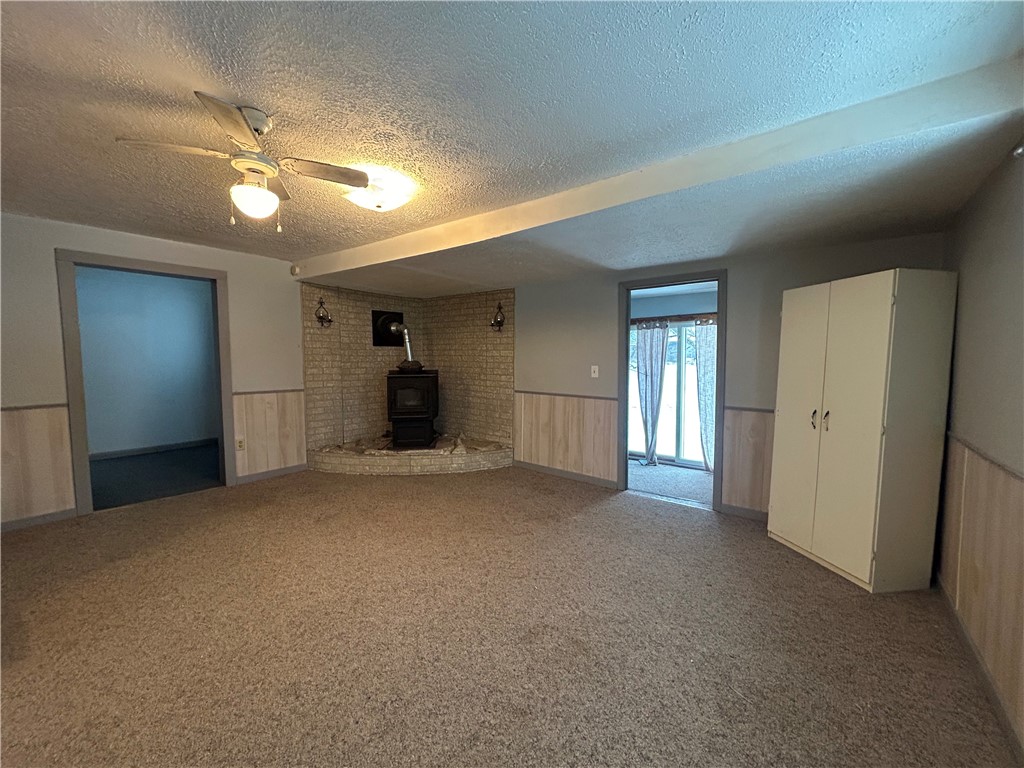 9580 Lodi Center Road Lodi, NY 14860 - Photo 5 of 12 Spacious living room with wood pellet stove.