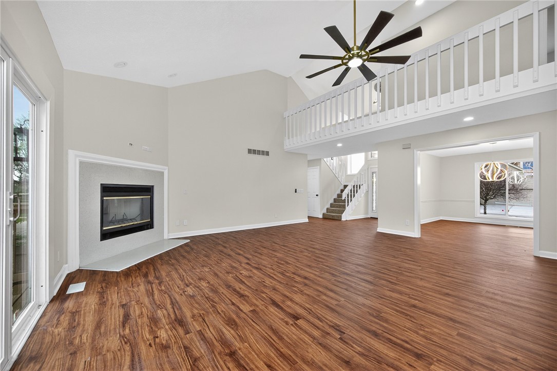 811 Wind Bluff Point Springboro, OH 45066 - Photo 5 of 51 This airy living space features a fireplace, vaulted ceilings, and a clear view of the stairway.