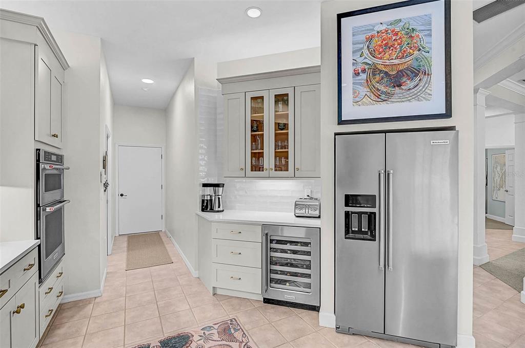 2050 Timucua Trail Nokomis, FL 34275 - Photo 12 of 50 a kitchen with a refrigerator and cabinets