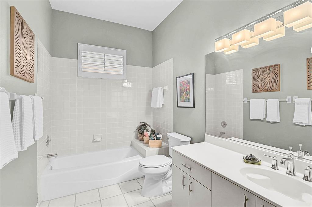 2050 Timucua Trail Nokomis, FL 34275 - Photo 26 of 50 a bathroom with a sink a toilet and a bathtub