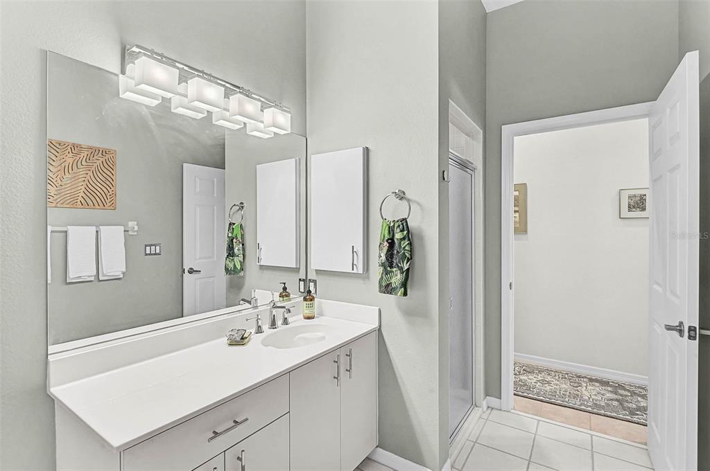 2050 Timucua Trail Nokomis, FL 34275 - Photo 27 of 50 a bathroom with a double vanity sink mirror and shower