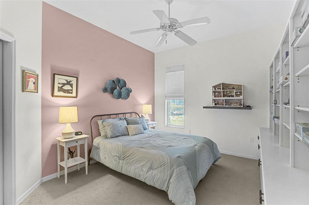 2050 Timucua Trail Nokomis, FL 34275 - Photo 28 of 50 a bedroom with a bed and a chandelier
