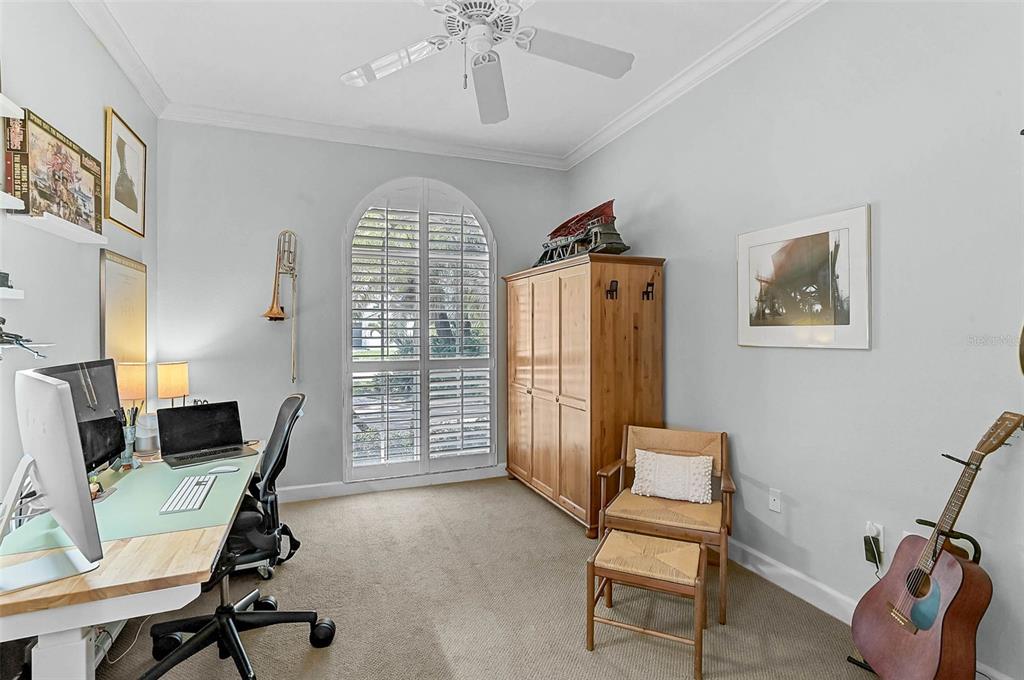 2050 Timucua Trail Nokomis, FL 34275 - Photo 30 of 50 a view of a workspace with furniture and a window