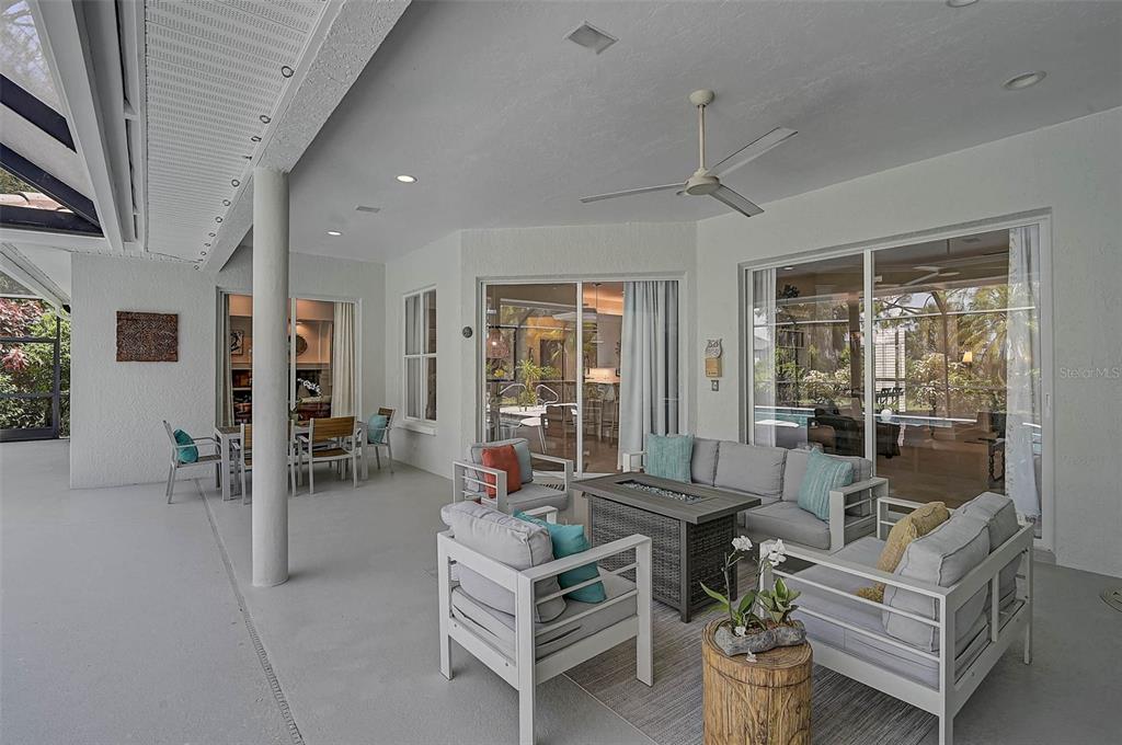 2050 Timucua Trail Nokomis, FL 34275 - Photo 32 of 50 a living room with furniture a table and chairs