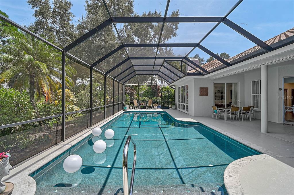 2050 Timucua Trail Nokomis, FL 34275 - Photo 37 of 50 a backyard of a house with seating space