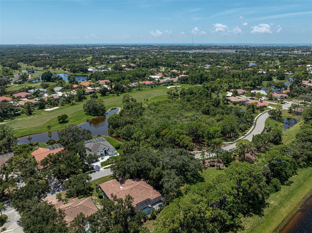 2050 Timucua Trail Nokomis, FL 34275 - Photo 47 of 50 an aerial view of residential houses with outdoor space and trees