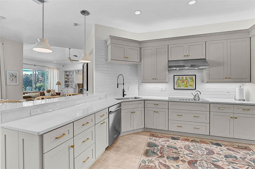 2050 Timucua Trail Nokomis, FL 34275 - Photo 9 of 50 a kitchen with sink cabinets and wooden floor