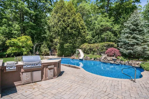 a view of a chairs and table in the patio