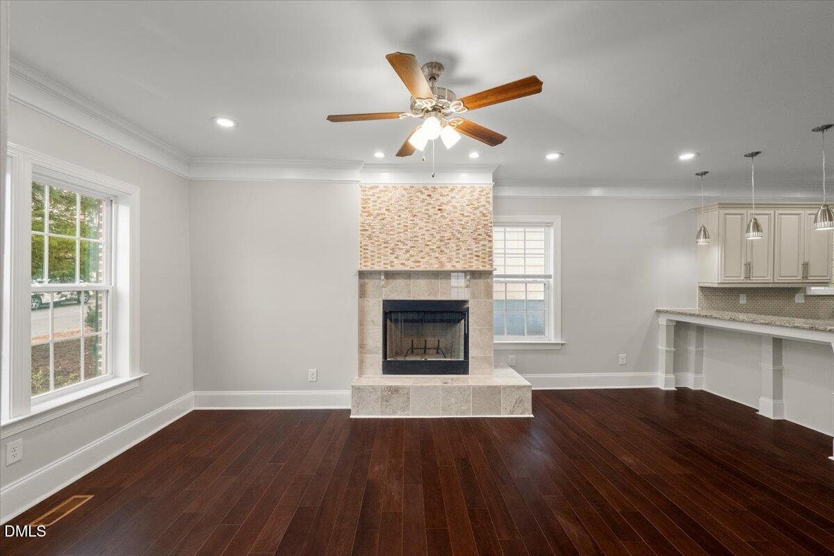 2402 Green Street Durham, NC 27705 - Photo 8 of 25 a view of an empty room with a fireplace and a window