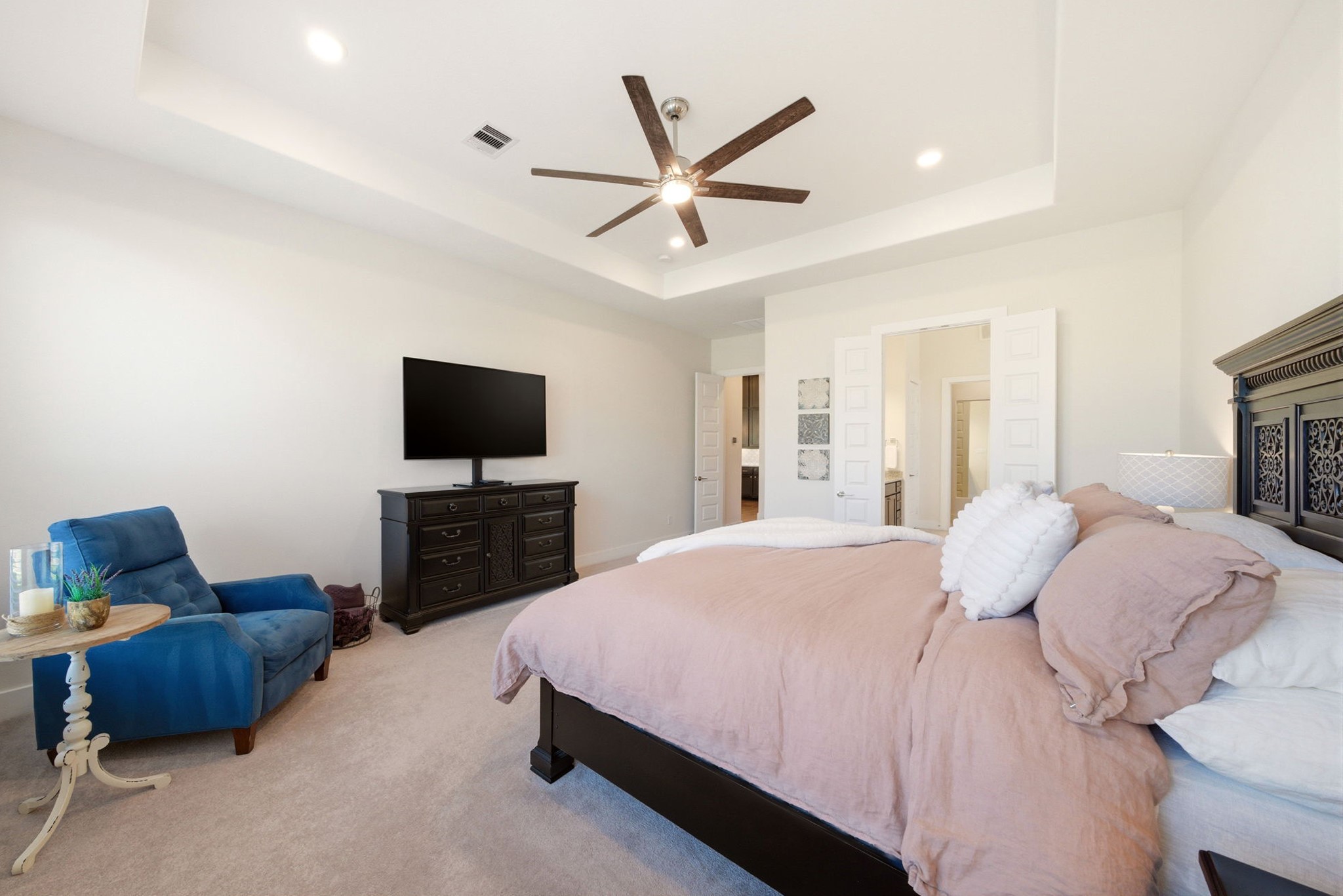 28811 Ember Crest Lane Fulshear, TX 77441 - Photo 19 of 47 a bedroom with a bed and a flat screen tv