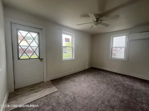 an empty room with windows