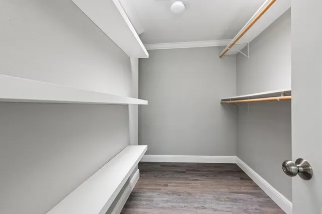 a view of an empty walk in closet