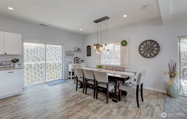 a view of a dining room with furniture and wooden floor