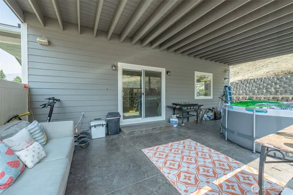 a balcony with furniture and a potted plant