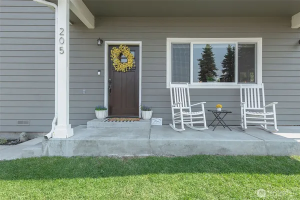 a view of front door and a chair
