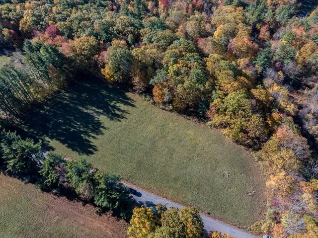 a view of balcony with wooden floor