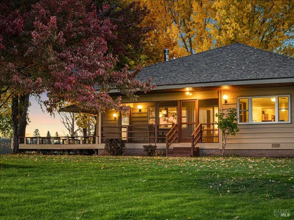 a view of a house with a yard